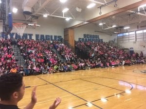 Students on bleachers for Pink Shirt Day Assembly