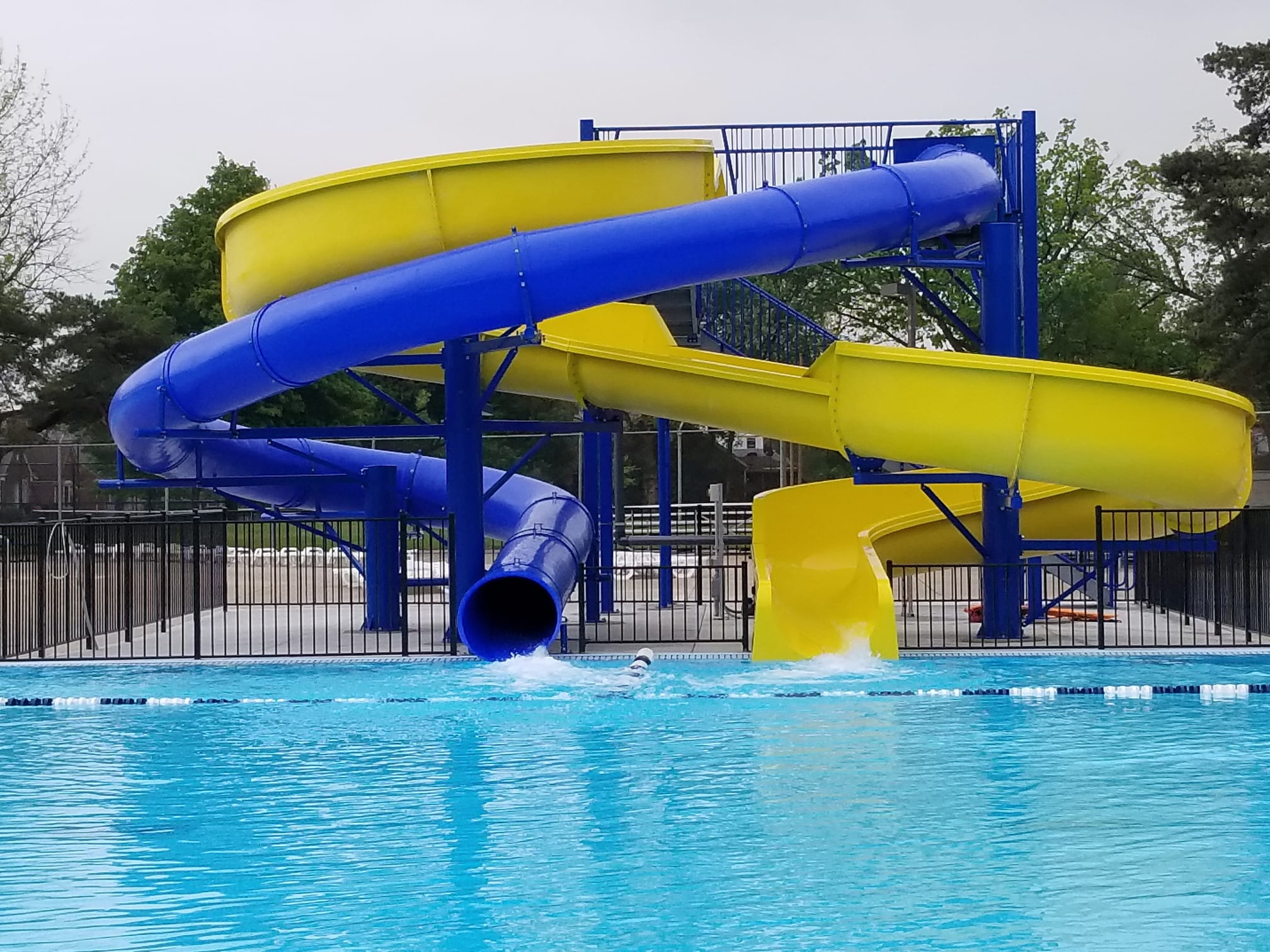 blue and yellow slide with water